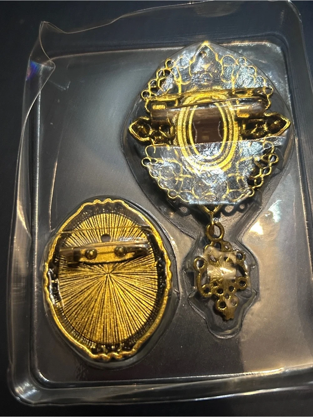 Gold-Tone Cameo Brooch Set with Ruby and Amber Accents
